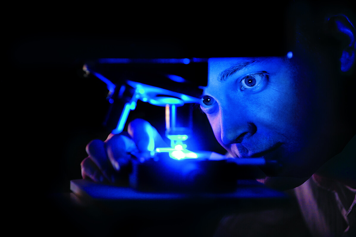 Scientist using a microscope