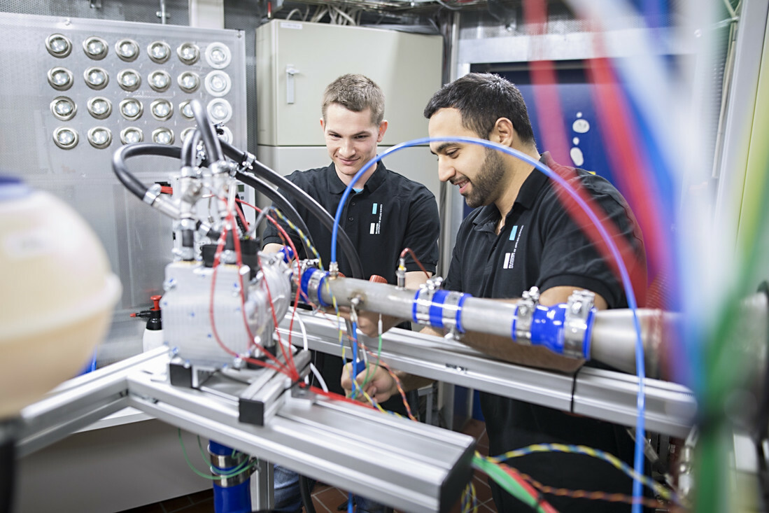 Students conduct an engine test bench.